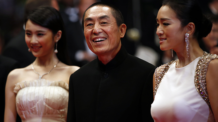 Zhang Huiwen, Zhang Yimou and Gong Li © AFP / VH