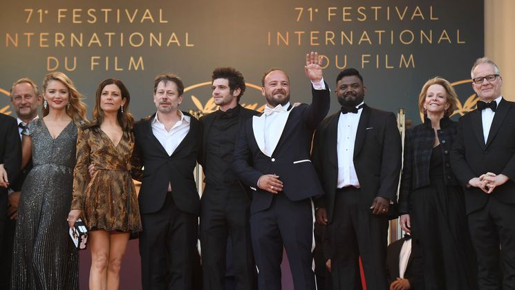 Team of the film Le Grand Bain (Sink Or Swim) © Anne-Christine Poujoulat/AFP