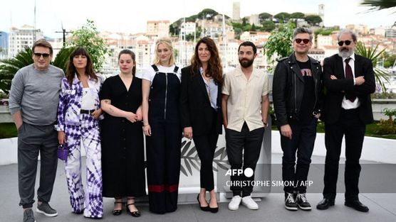 (From L) French actor Benoit Magimel, French actress and singer Juliette Armanet, French actress Anna Biolay, French actress Nadia Tereszkiewicz, French director Stephanie Di Giusto, French actor Guillaume Gouix, French actor Benjamin Biolay and French actor Gustave Kervern pose during a photocall for the film "Rosalie" during the 76th edition of the Cannes Film Festival in Cannes, southern France, on May 18, 2023. (Photo by CHRISTOPHE SIMON / AFP)