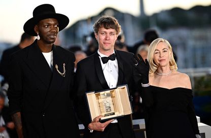 Halfdan Ullmann Tondel winner of the Camera d'Or with Baloji and Emmanuelle Beart LOIC VENANCE / AFP